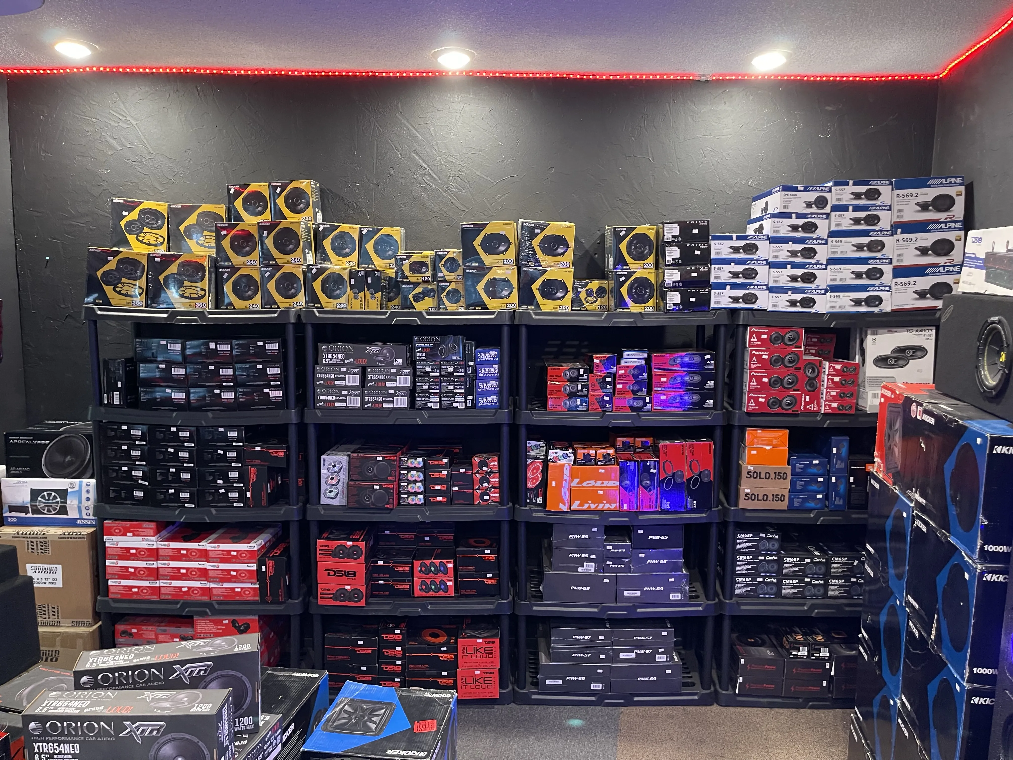 Shelves stocked with a wide variety of speakers.