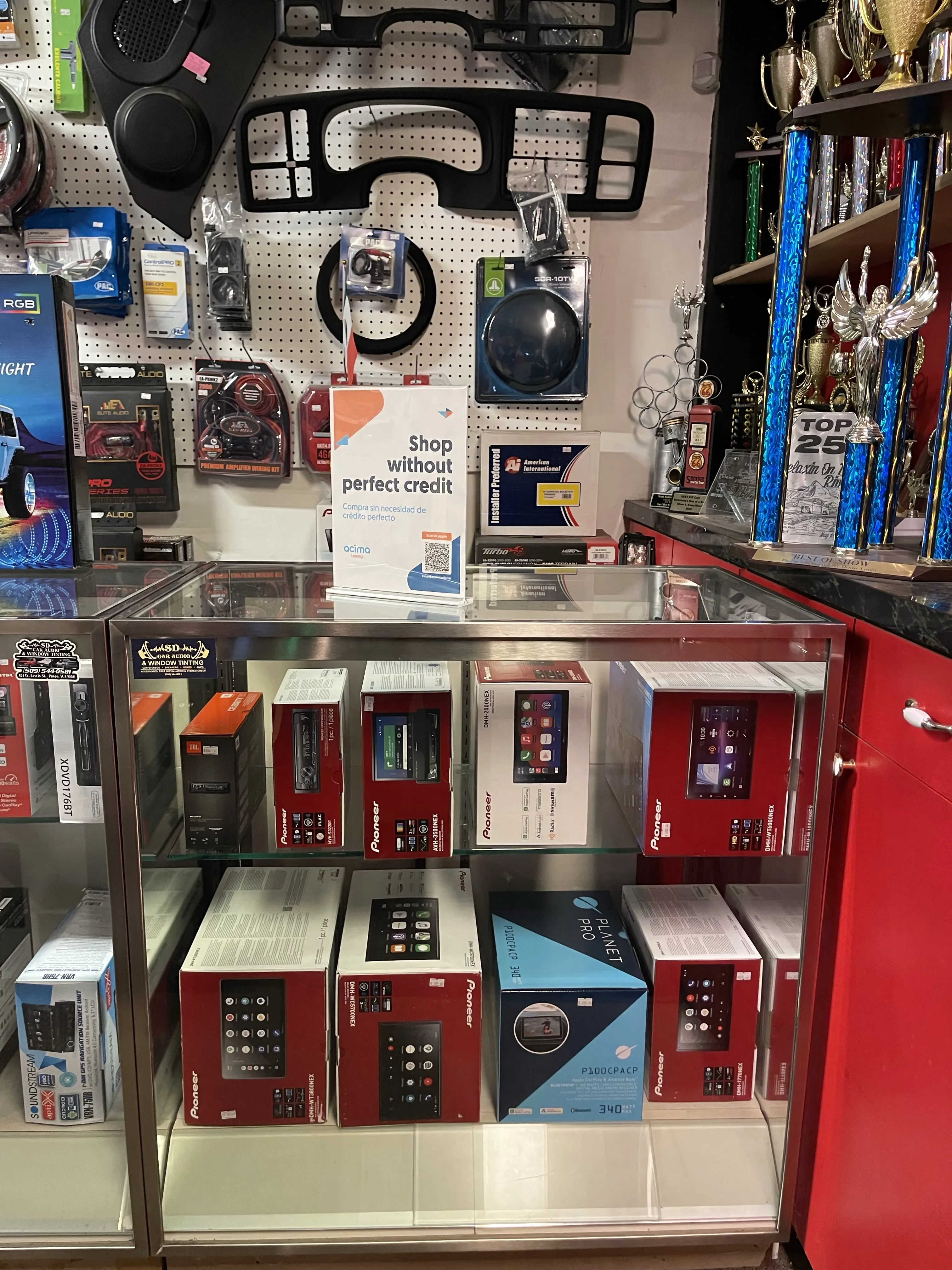 Store counter showing sign with message: 'shop without perfect credit'.