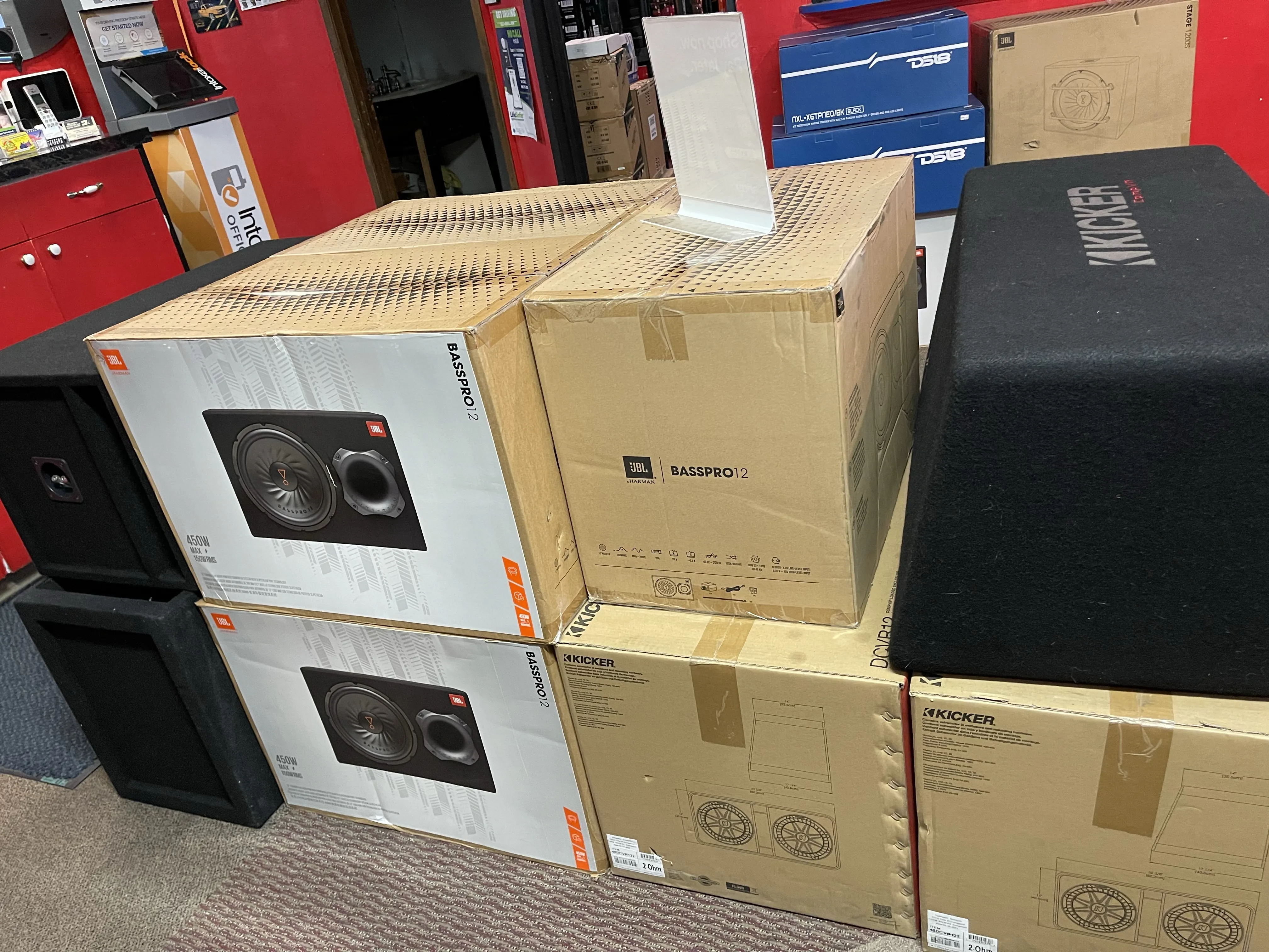 Closeup view of a stacked boxes of subwoofers.
