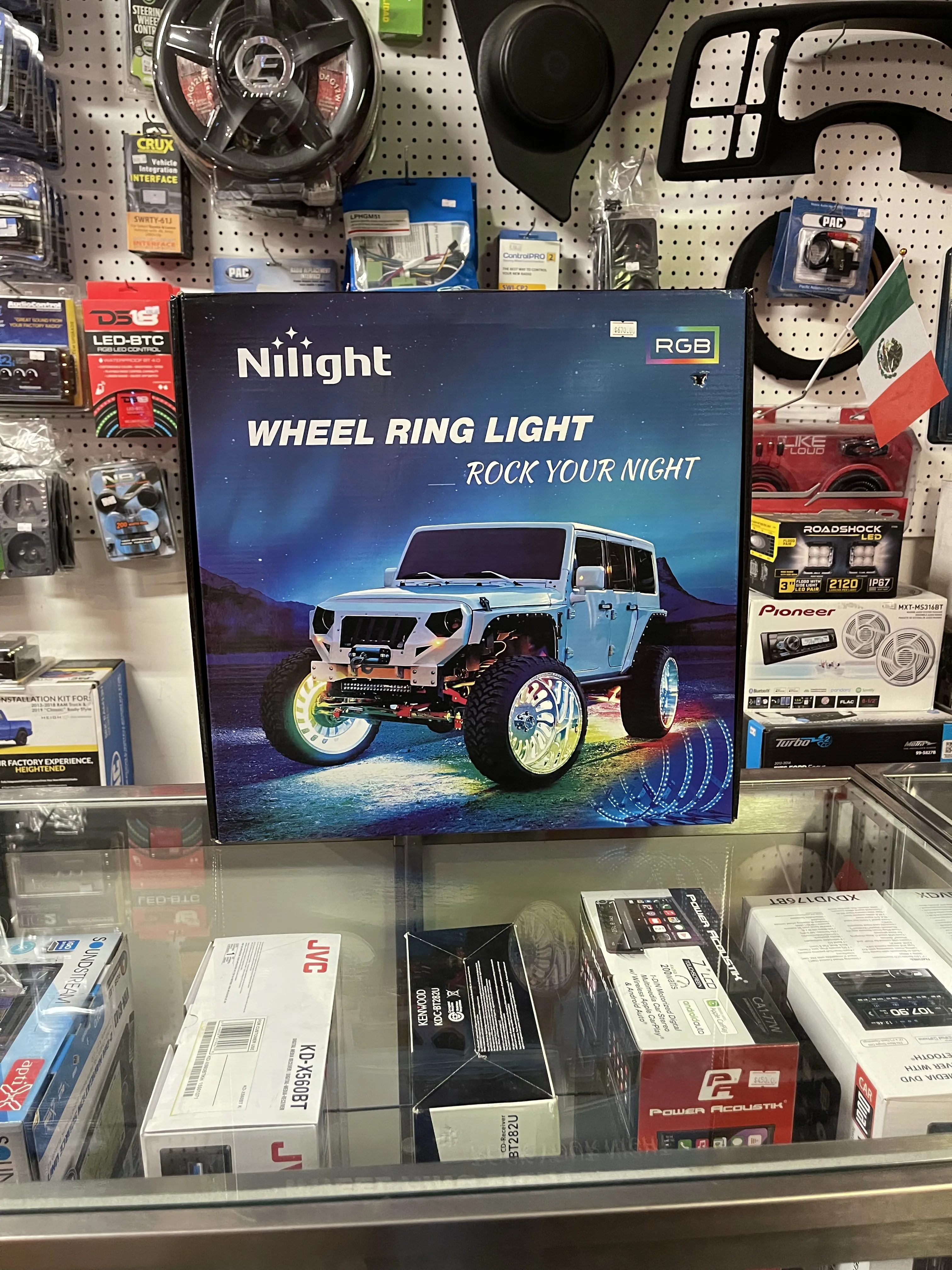 Closeup view of box of vehicle wheel ring lights on store counter.